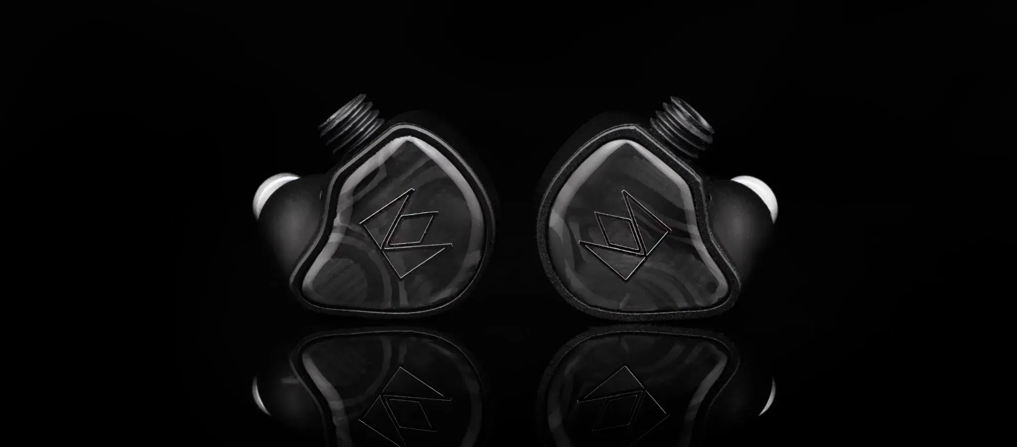 Noble Audio XM-1 front hero banner over black reflective background