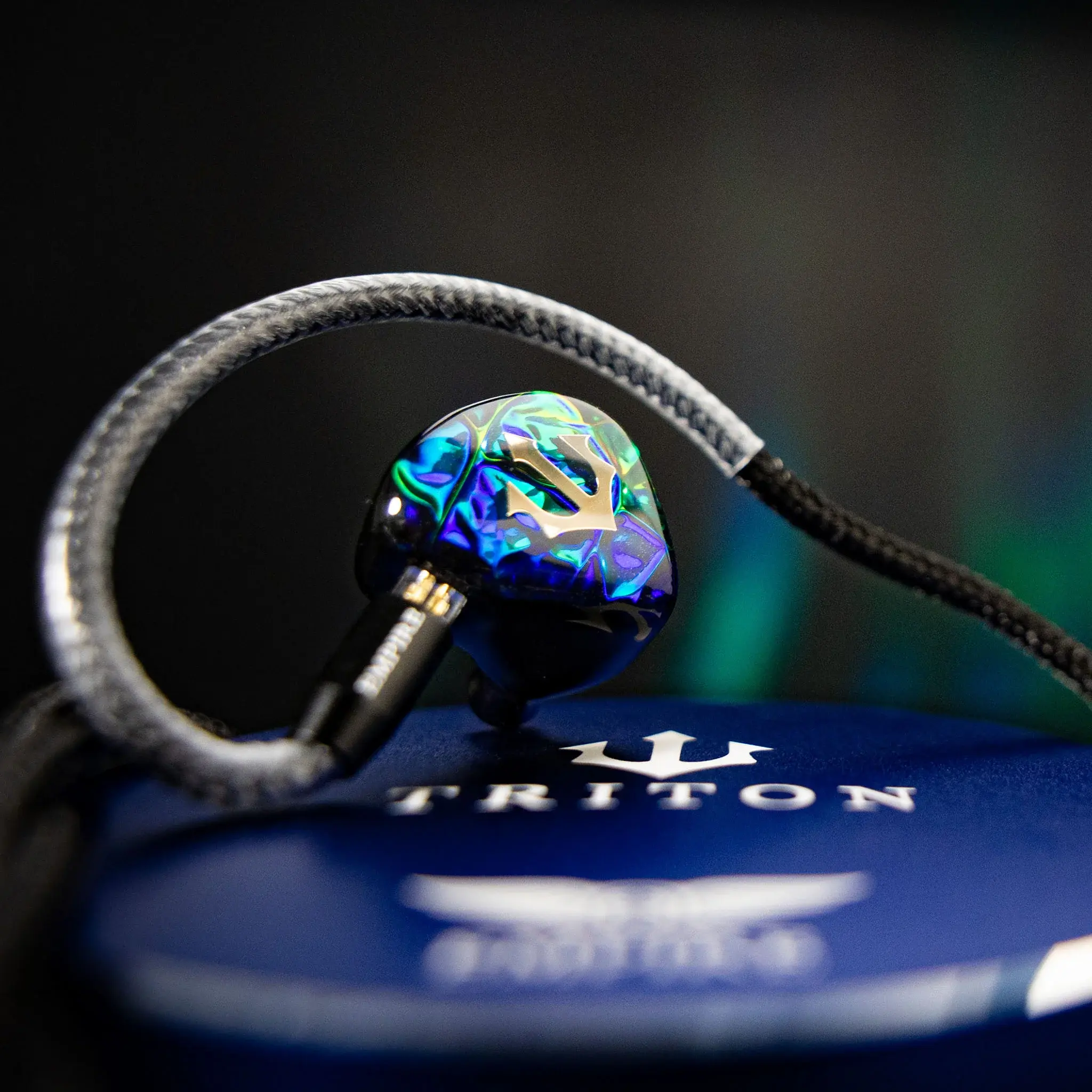 Empire ears trident iem closeup with blue background